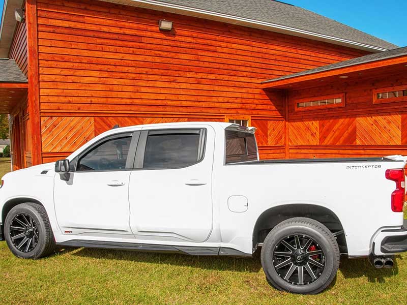 A ZR4 Interceptor Edition parked in front of a cabin