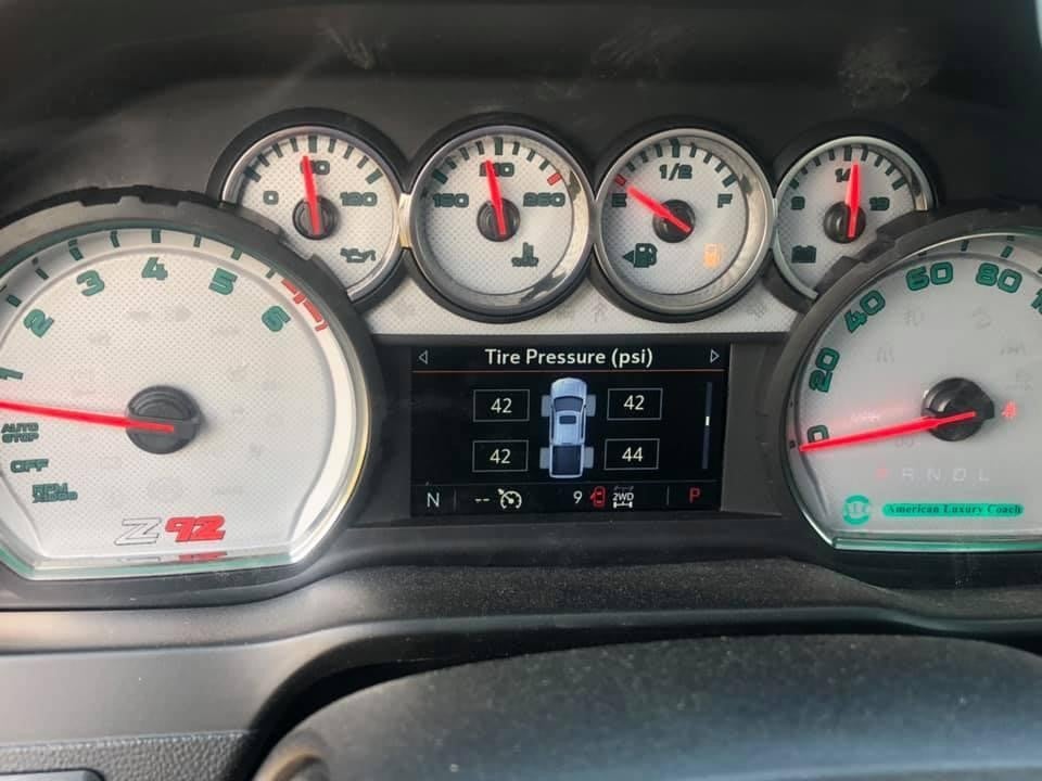 Custom dashboard accents inside an American Luxury Coach Silverado