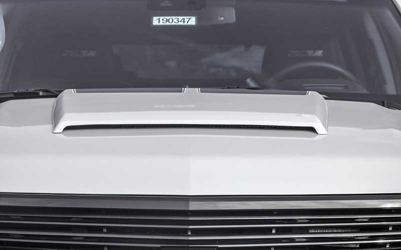 The front view of the hood vent with grill and windshield of the Tahoe Premier